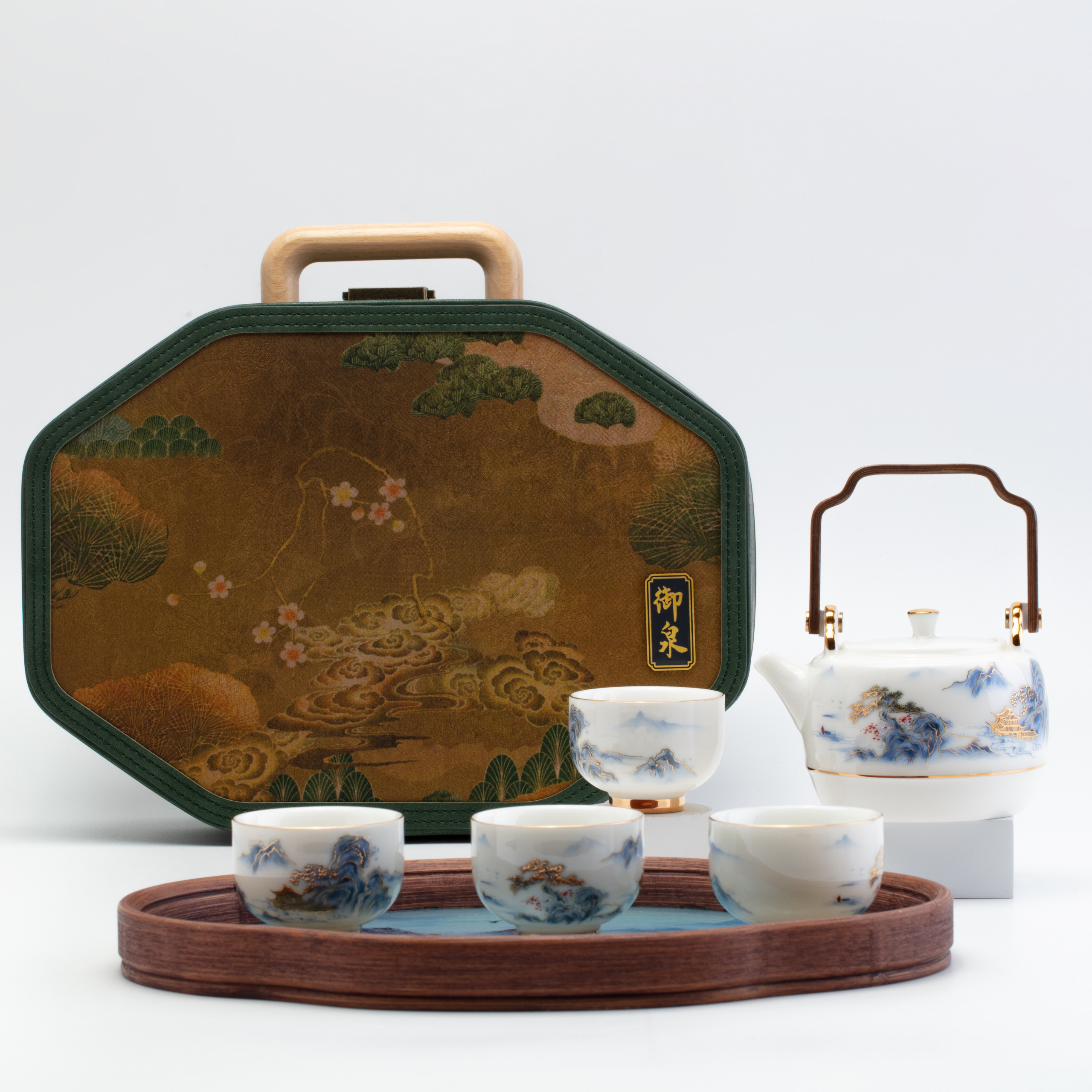 Tea set with teapot, cups, and tray on a white background