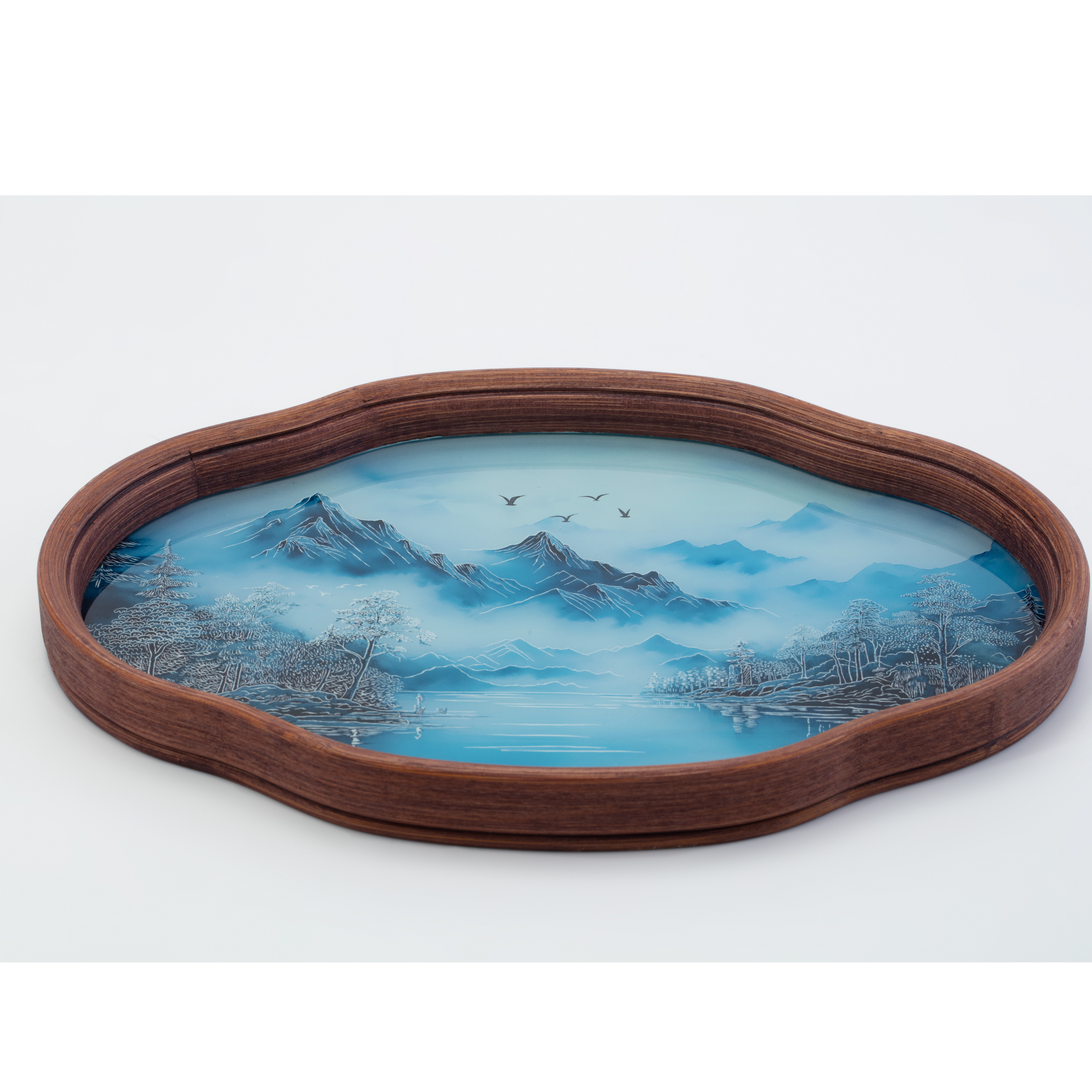 Decorative tray with a mountain landscape design on a white background