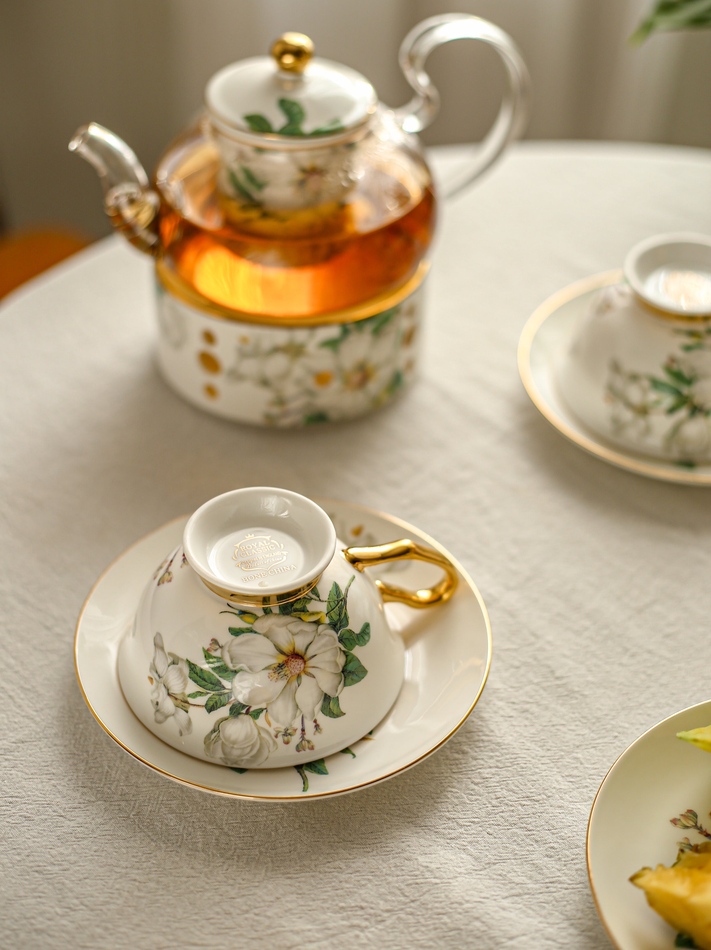 Tea set with floral design on a table