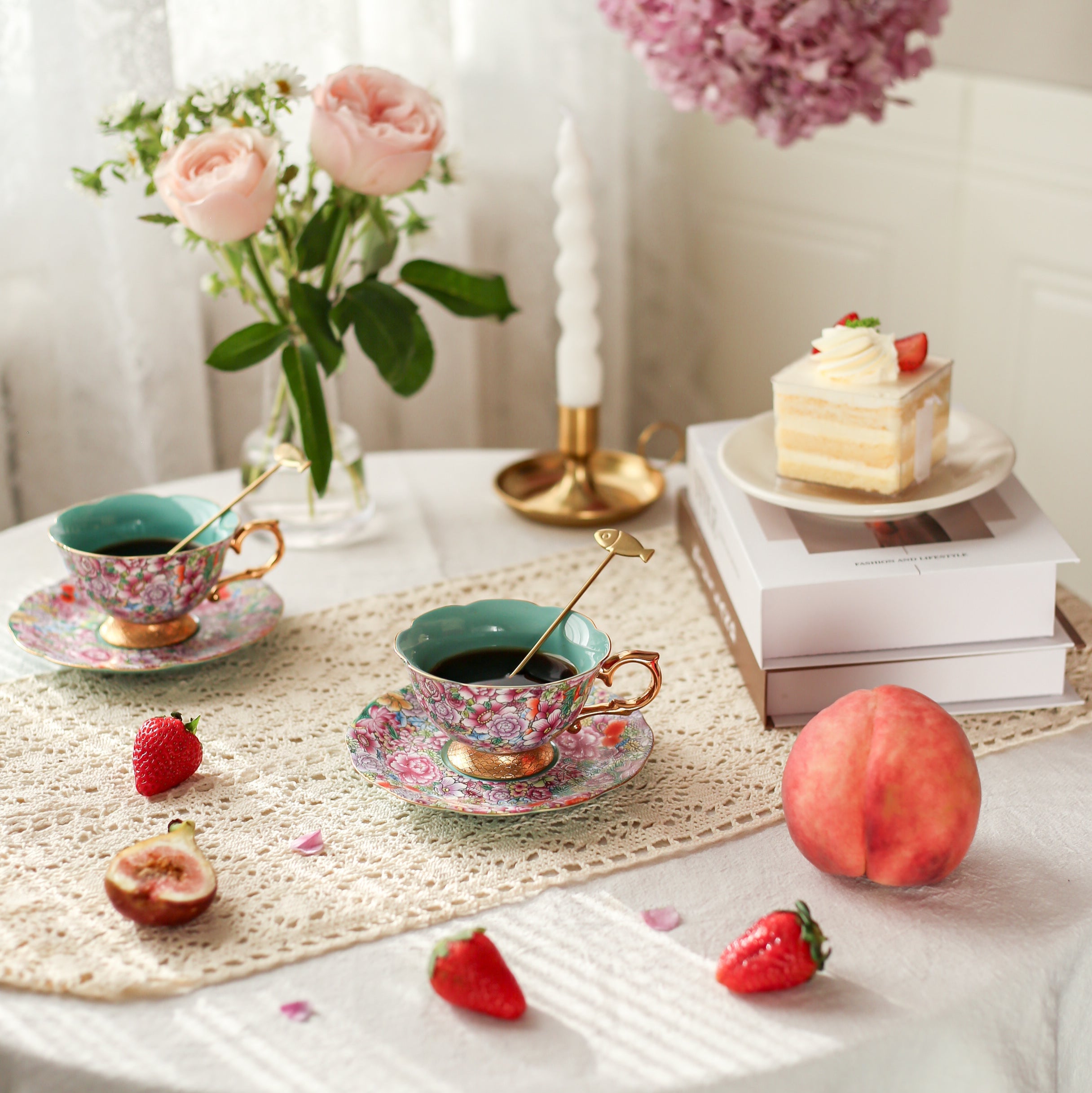 Tea set with flowers and desserts on a table