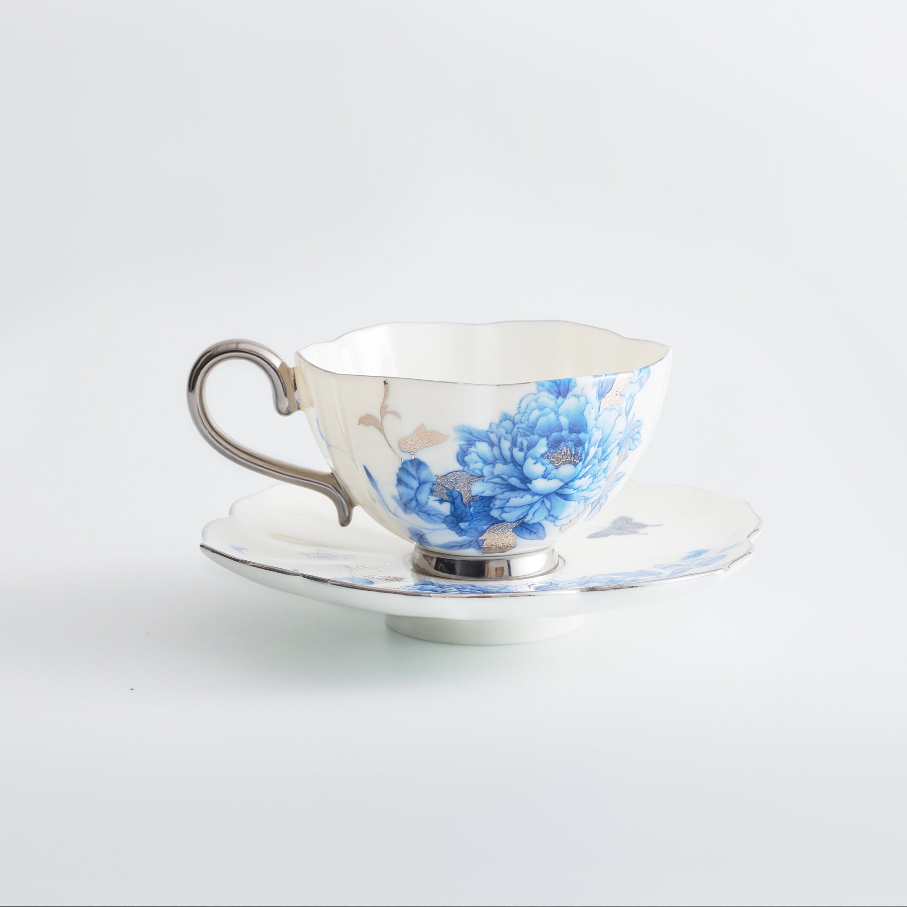 Teacup with floral design on a white background