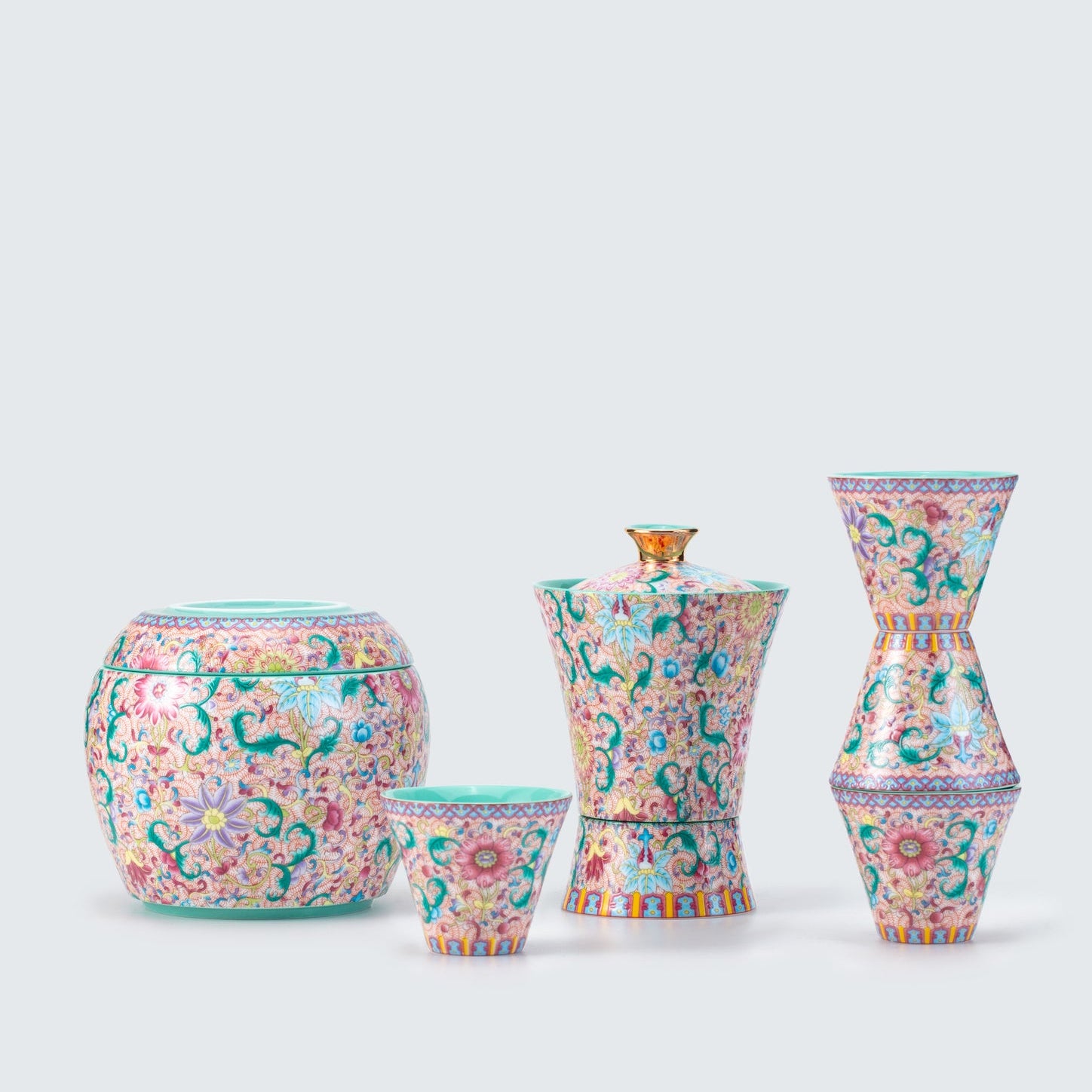 Set of colorful ceramic vases on a light gray background