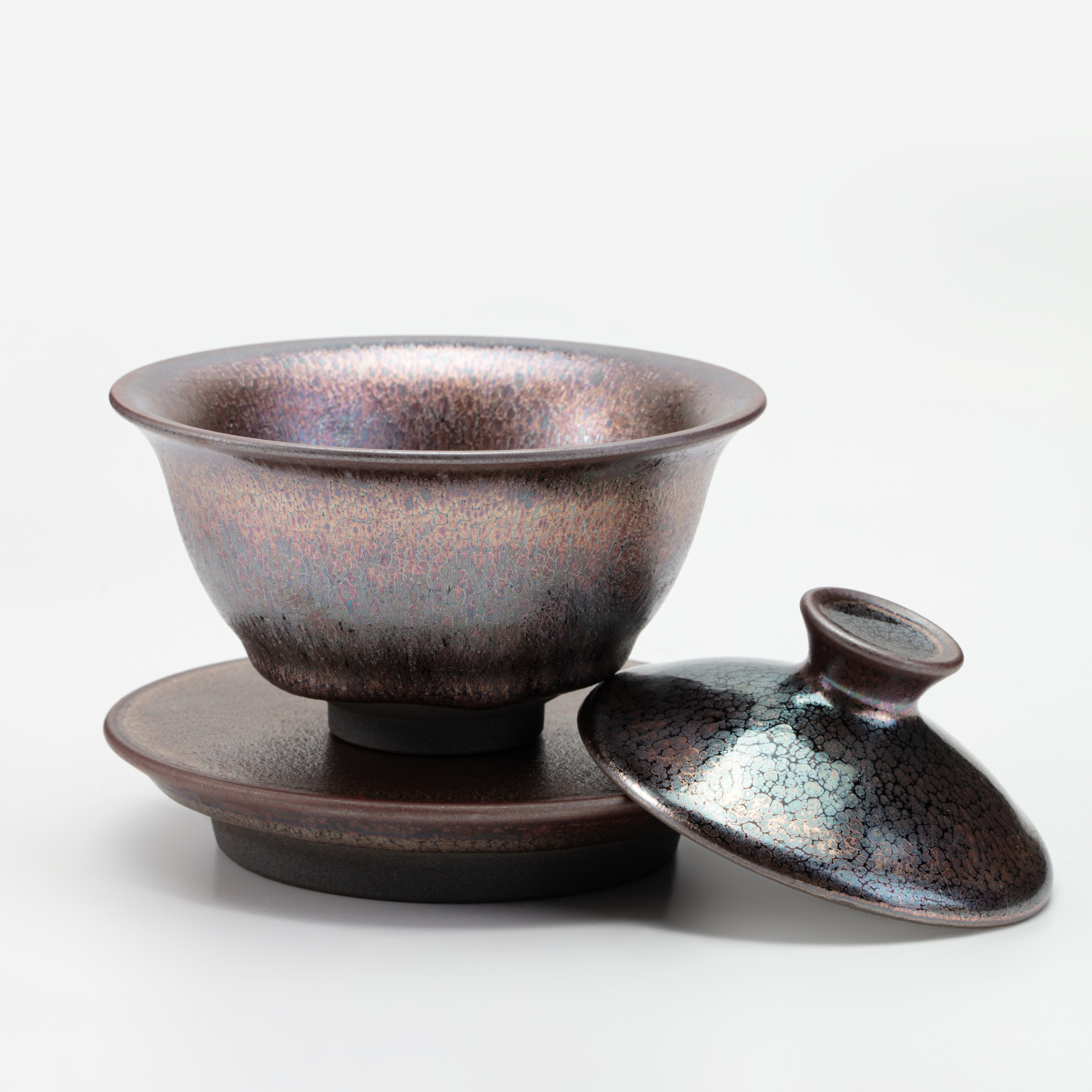 Ceramic teacup with lid on a white background
