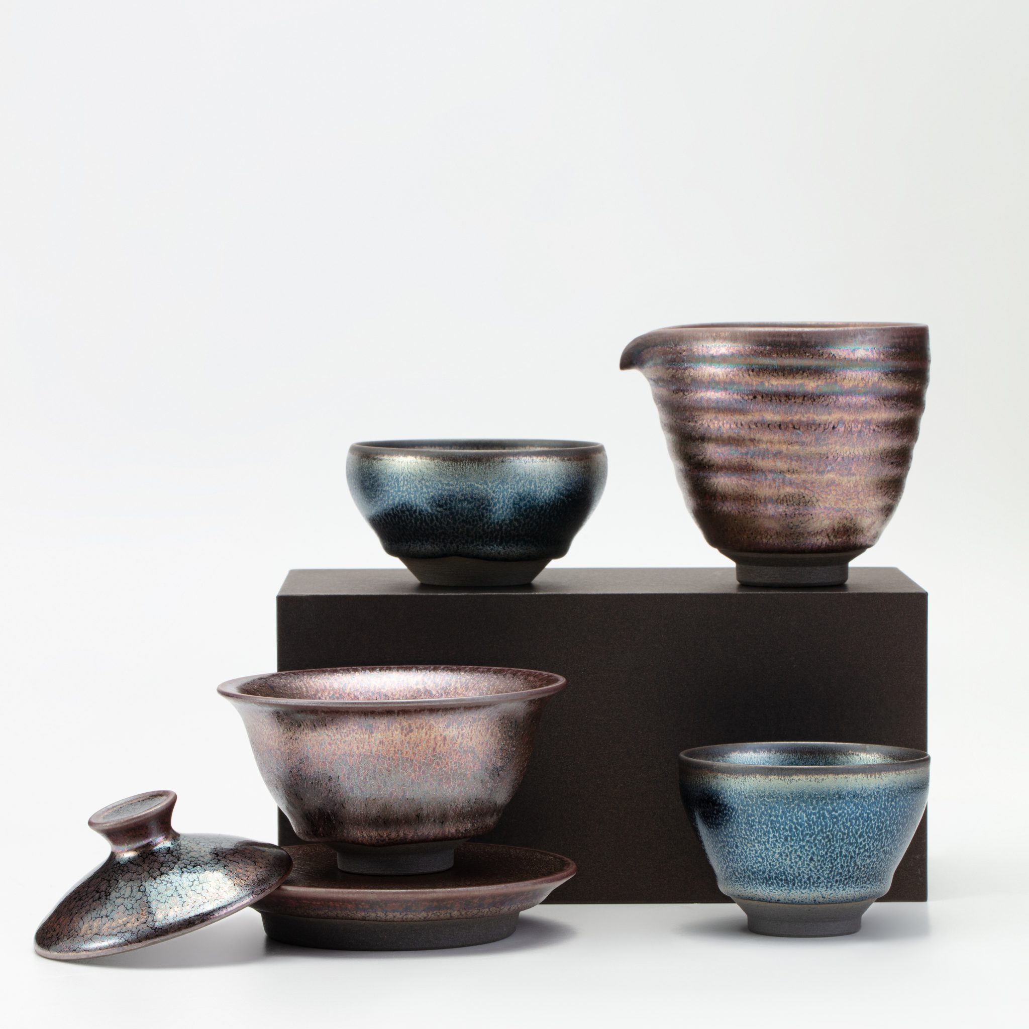 Set of ceramic bowls with textured finish on a white background