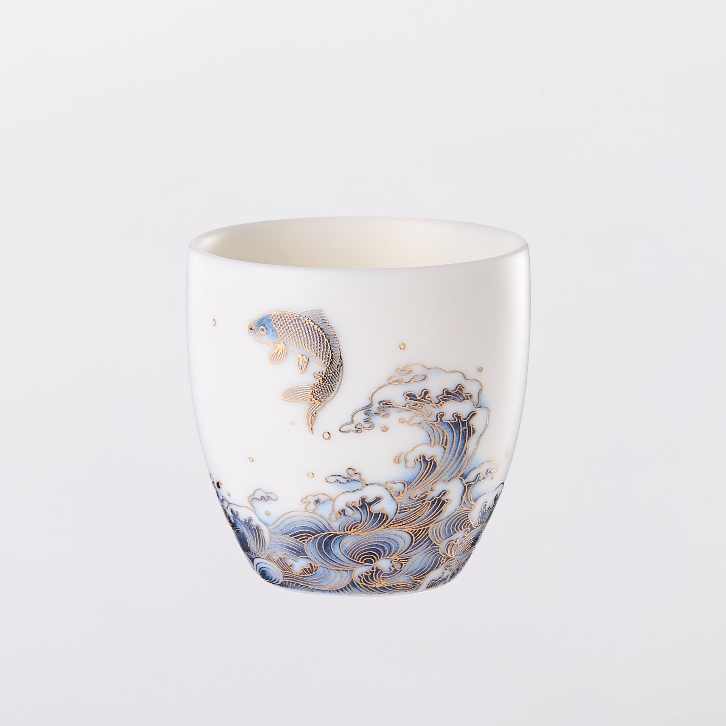 Decorative ceramic cup with abstract patterns on a white background