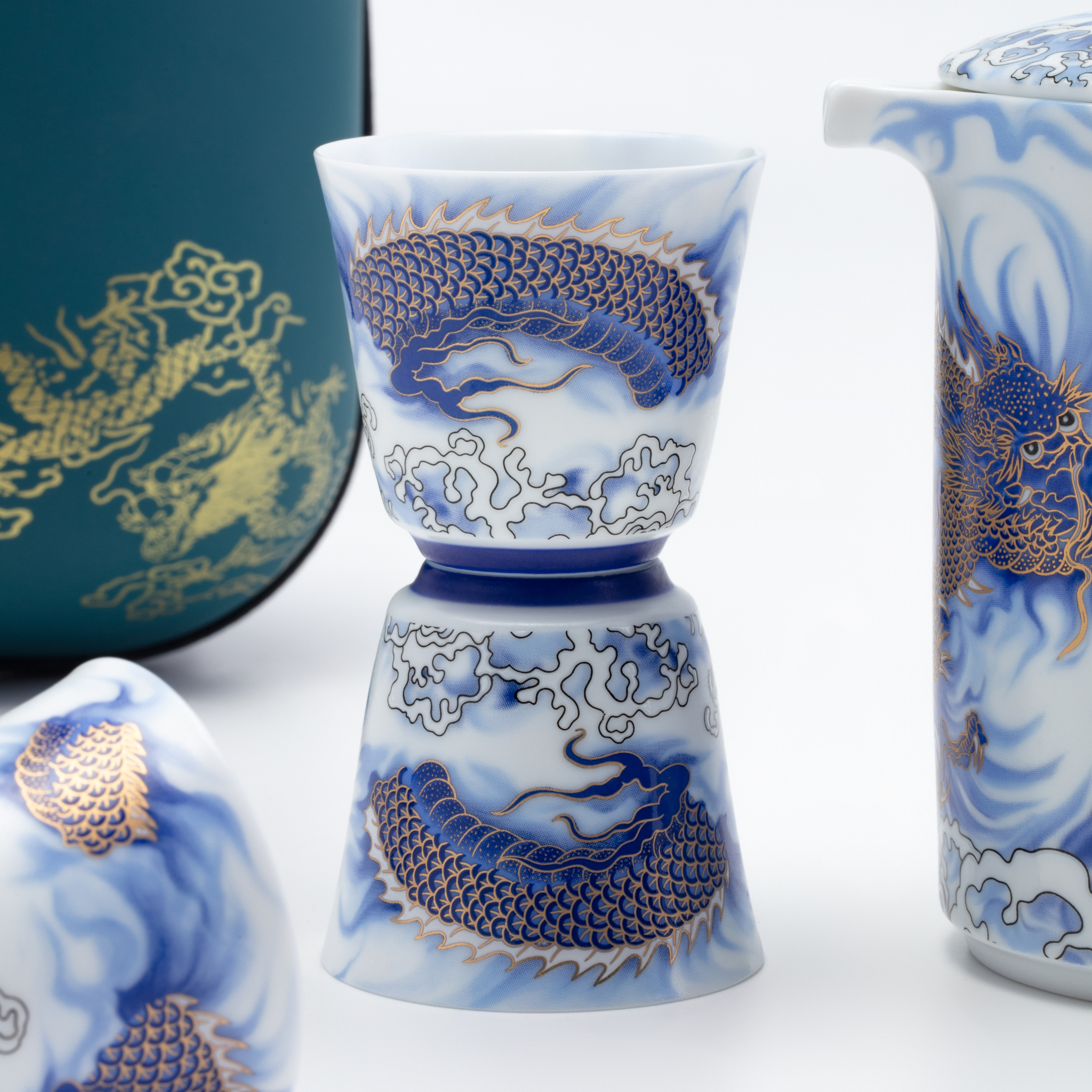 Ceramic cup with blue dragon design on a white background